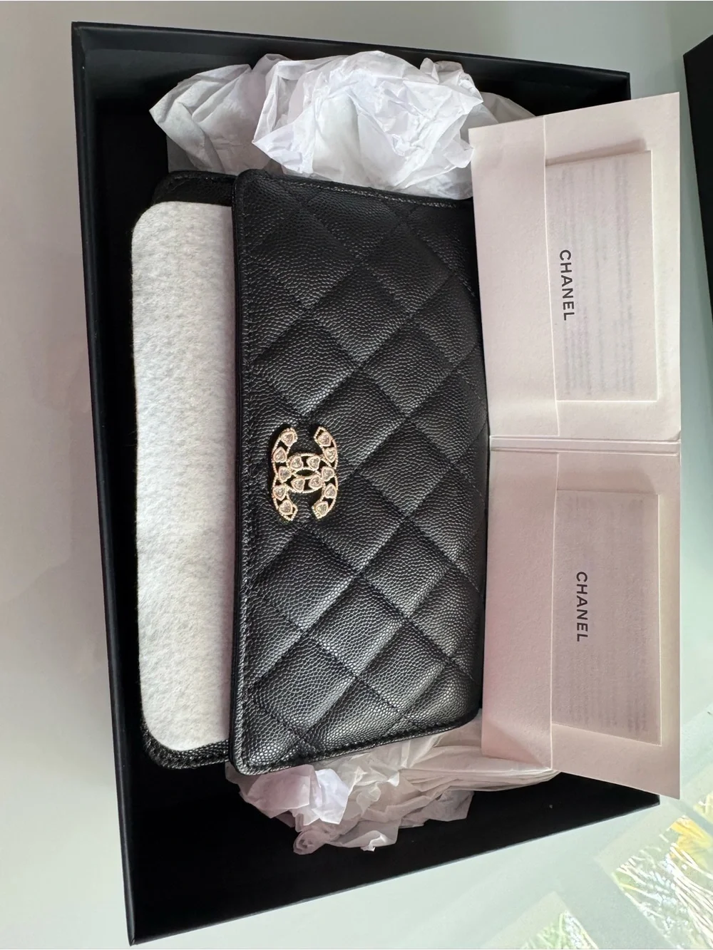 CHANEL WOC Black caviar leather with Gold Hardware and heart shaped crystal logo
